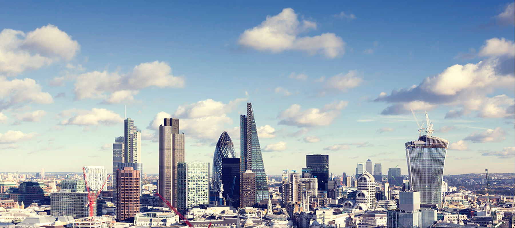 a photo of london skyline with the gherkin in the centre