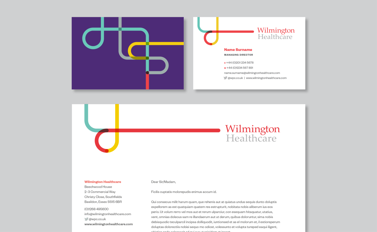 A mockup of a business card and a letterhead in the wilmington healthcare brand