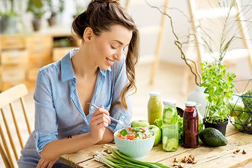 a women looking at food that support with hair growth