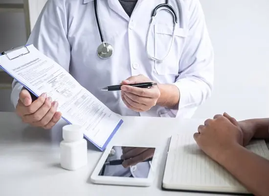 Doctor showing patient chart 