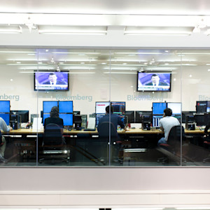 Five INTO Students work on large four screen computers at Bloomberg as part of BSc Investment and Financial risk management Five INTO Students work on large four screen computers at Bloomberg as part of BSc Investment and Financial risk management