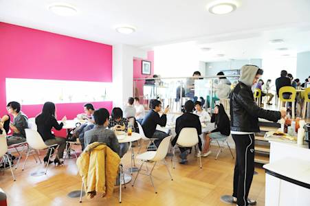 View of international students having lunch in the INTO Centre cafe View of international students having lunch in the INTO Centre cafe
