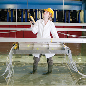 INTO Student conducting tests in a water tank INTO Student conducting tests in a water tank