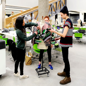A group of INTO students design and create a dress on mannequin A group of INTO students design and create a dress on mannequin