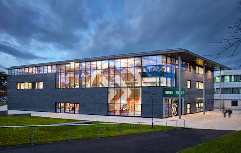 Exterior view in the evening of the INTO Centre at University of Stirling Exterior view in the evening of the INTO Centre at University of Stirling