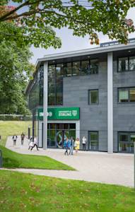 View of main entrance to the INTO Centre with international students outside View of main entrance to the INTO Centre with international students outside