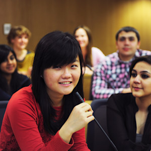 Student uses microphone in lecture theatre at University of Exeter Student uses microphone in lecture theatre at University of Exeter