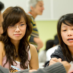 Two INTO students in computer lab. Two INTO students in computer lab.