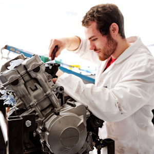 Engineering student works on engine at University of Exeter Engineering student works on engine at University of Exeter