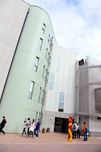 View of main entrance of the INTO Centre with international students outside View of main entrance of the INTO Centre with international students outside