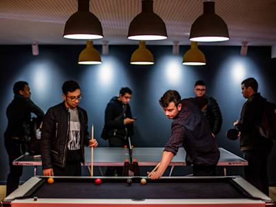 Students playing pool at Scape East student residences Students playing pool at Scape East student residences