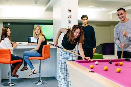 International students in Liberty Heights playing pool International students in Liberty Heights playing pool