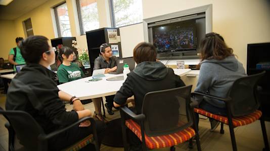 Students interact on Colorado State University video screen Students interact on Colorado State University video screen