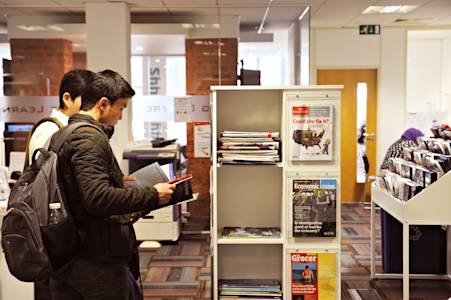 International students looking at resources in the Learning Resource Centre International students looking at resources in the Learning Resource Centre