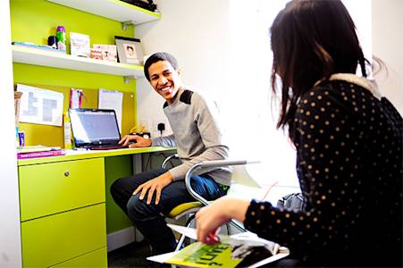 Students talking in a Shared Studio in the INTO Newcastle University student residences Students talking in a Shared Studio in the INTO Newcastle University student residences
