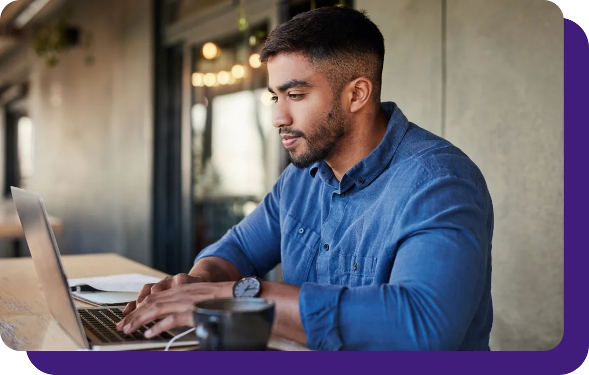 man on laptop with purple border