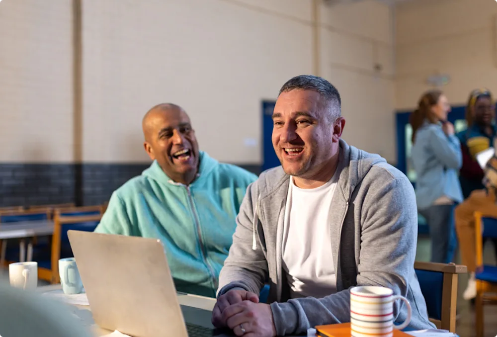 man working on laptop in non profit organization