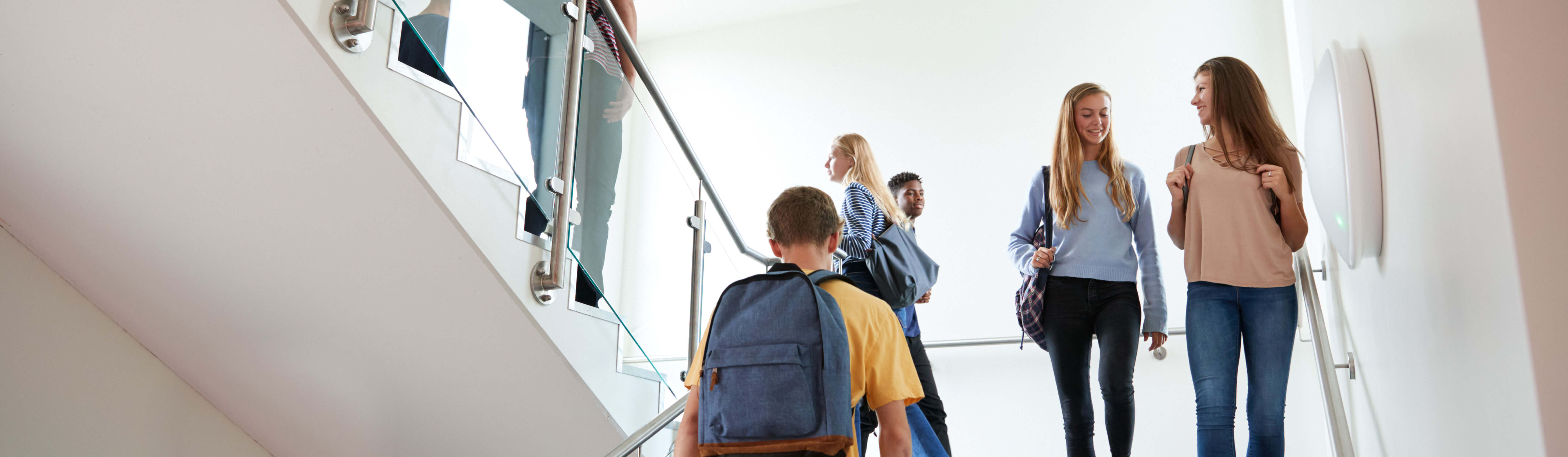 Student walking upstairs in high school