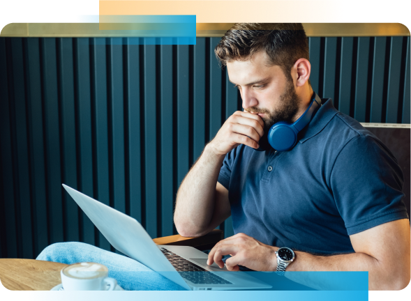 Man with headphones working on laptop