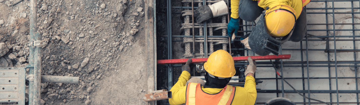 Construction workers setting rebar