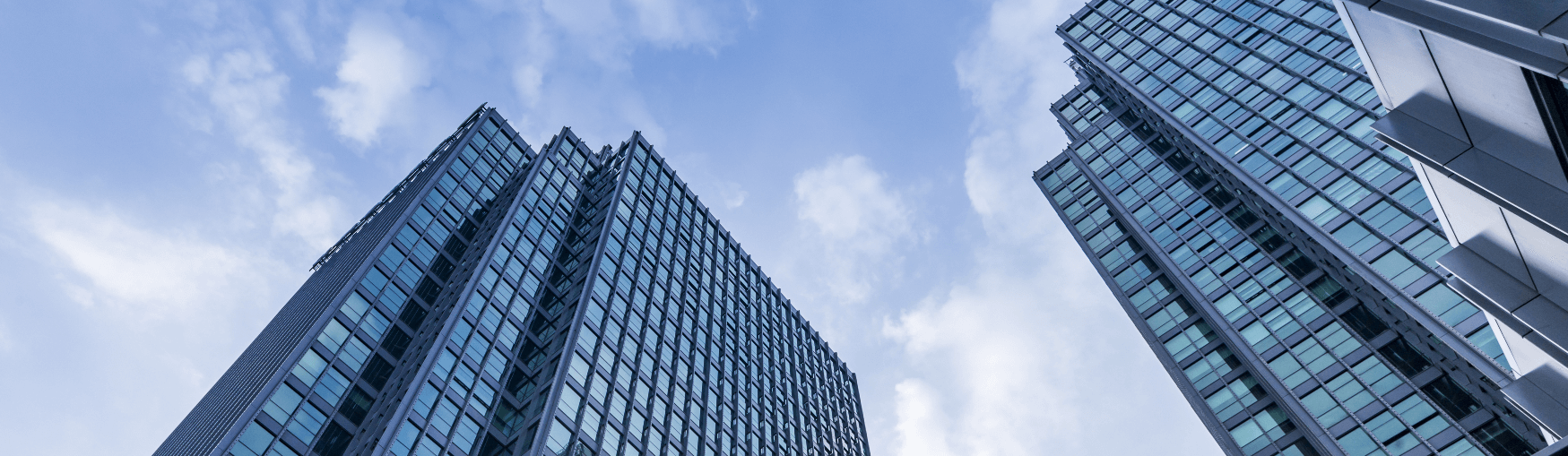 View of looking up at two tall skyscrapers