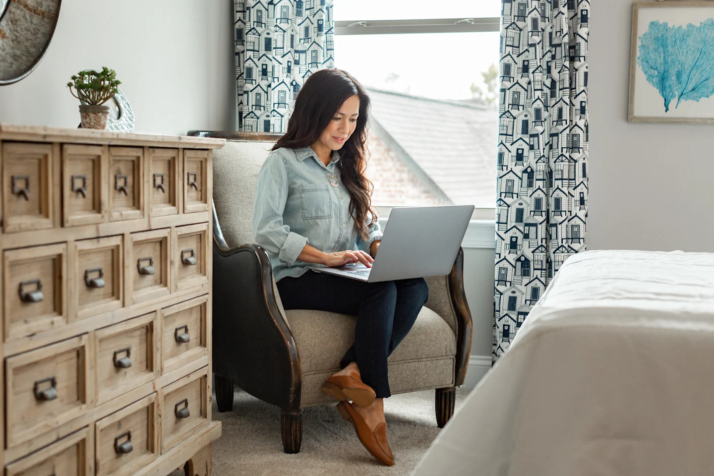 Home buyer working on laptop, using computer, Harris Doyle Lifestyle