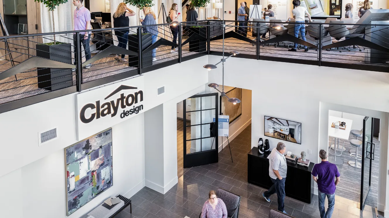 People walking around Clayton’s design space on the top and bottom floors.