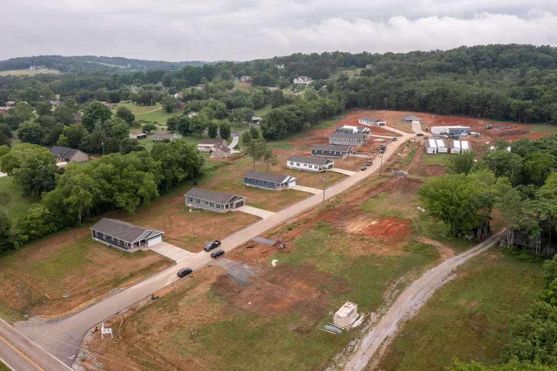 An aerial view of homes in a developing neighborhood.
