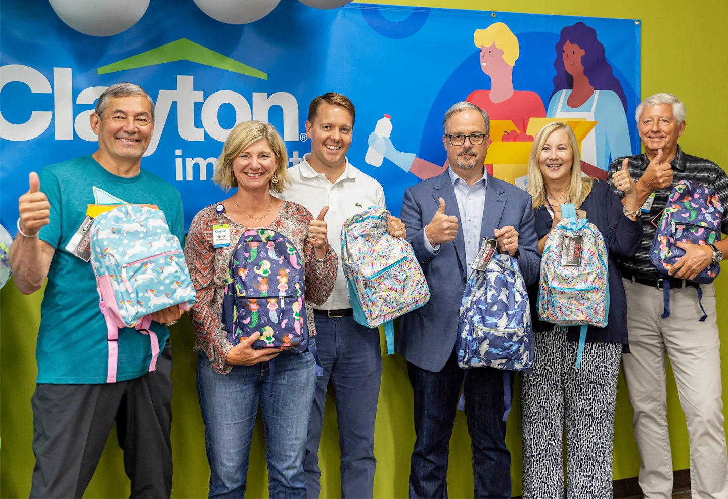 HBG Leaders fill backpacks at Clayton Impact event