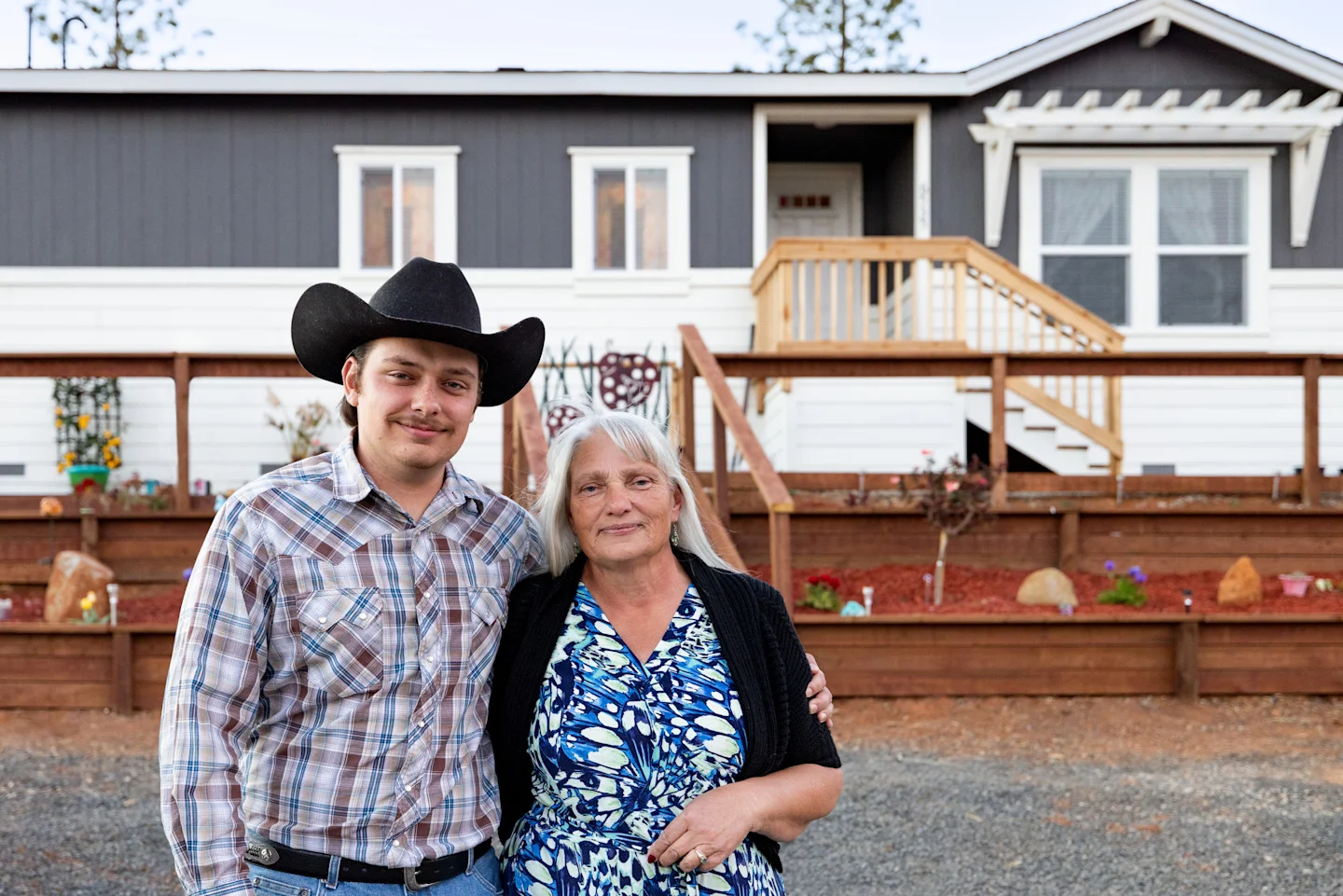 Shirley Birdsong and her son Salvador standing in front of their home