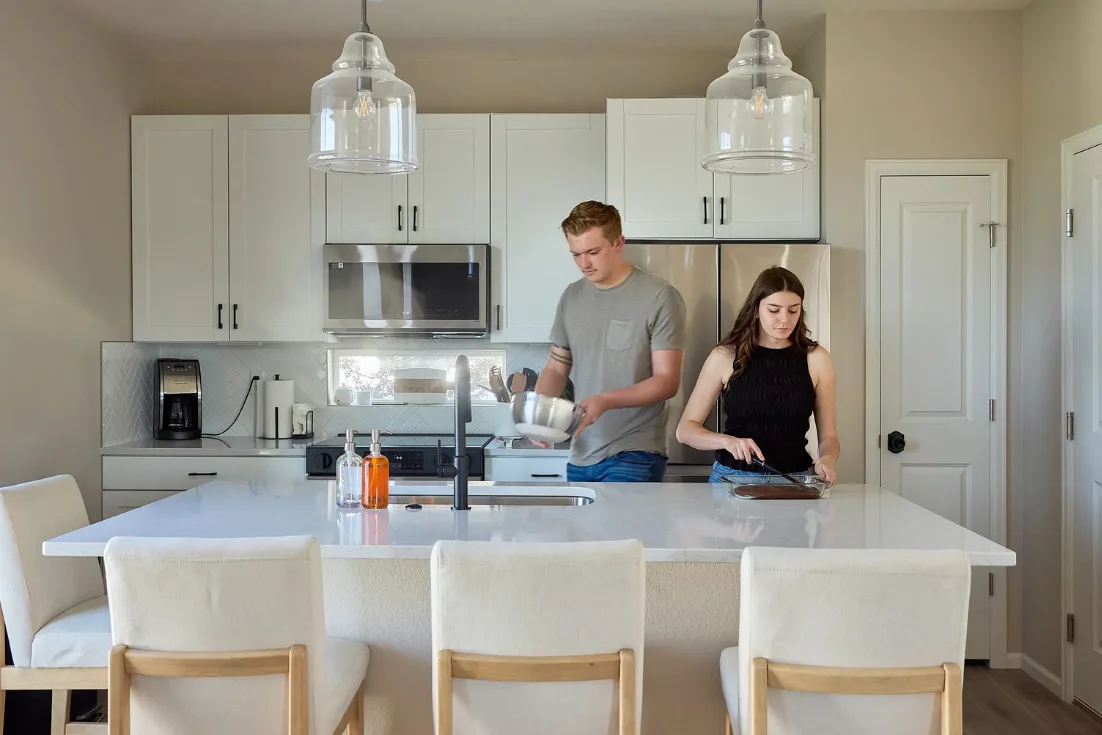 Couple living in their new construction home after securing financing with a lender of their choice.