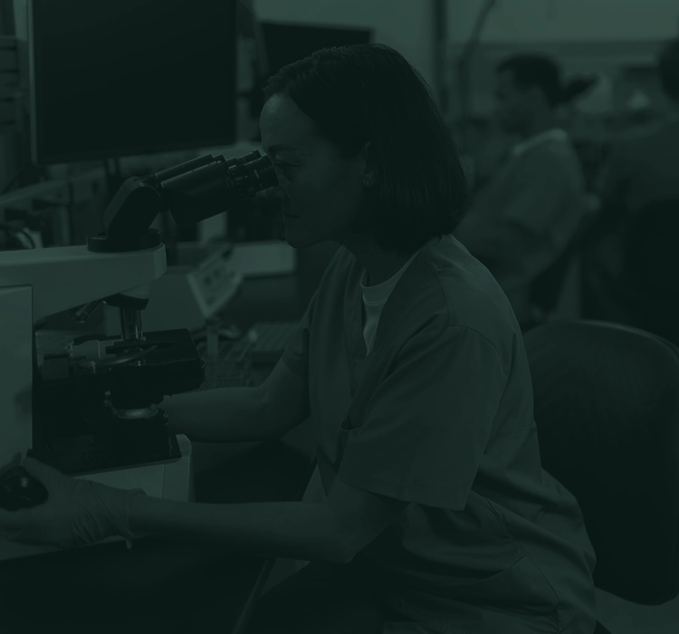 Lab technician working in a lab.