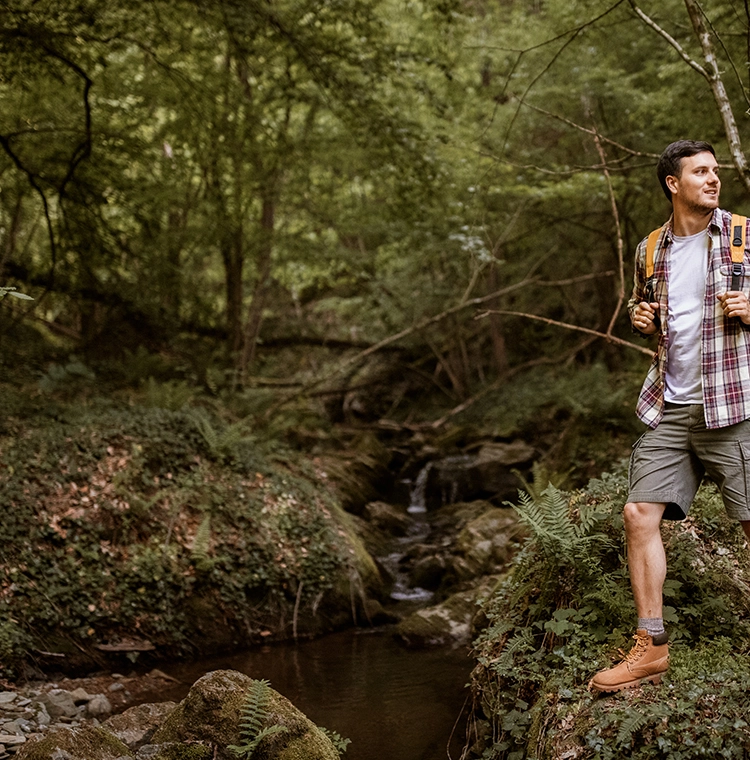 Man hiking in the woods.