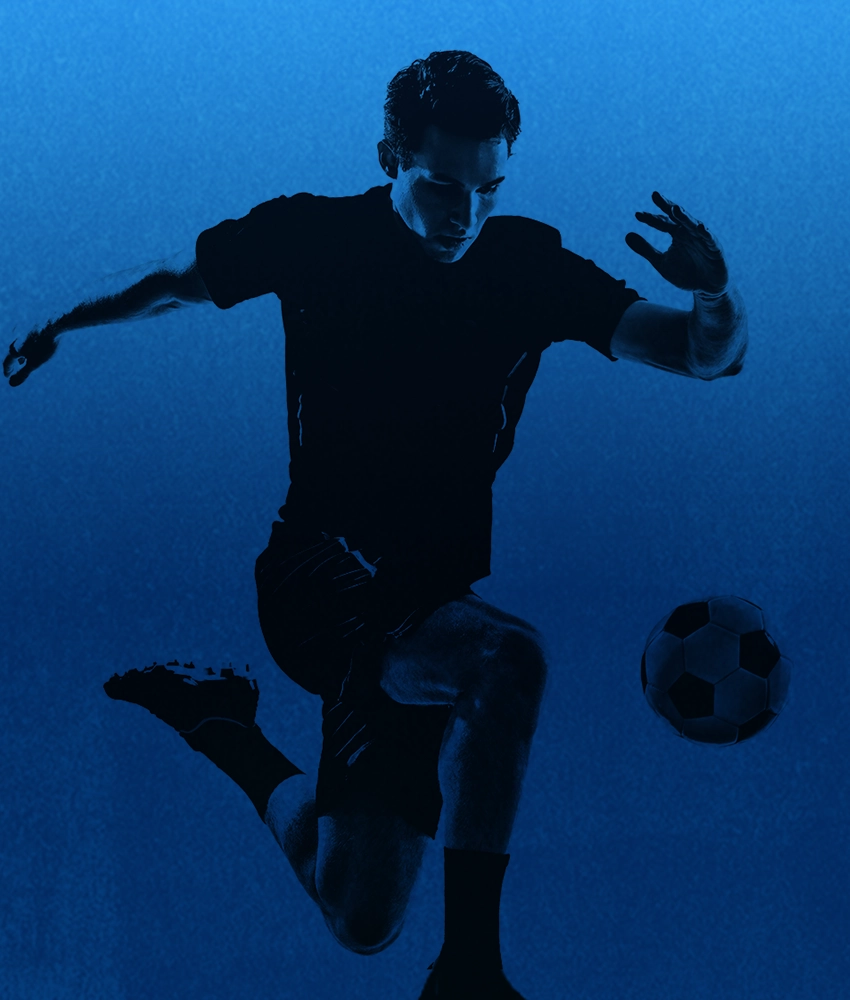 Man playing soccer with blue theme background.