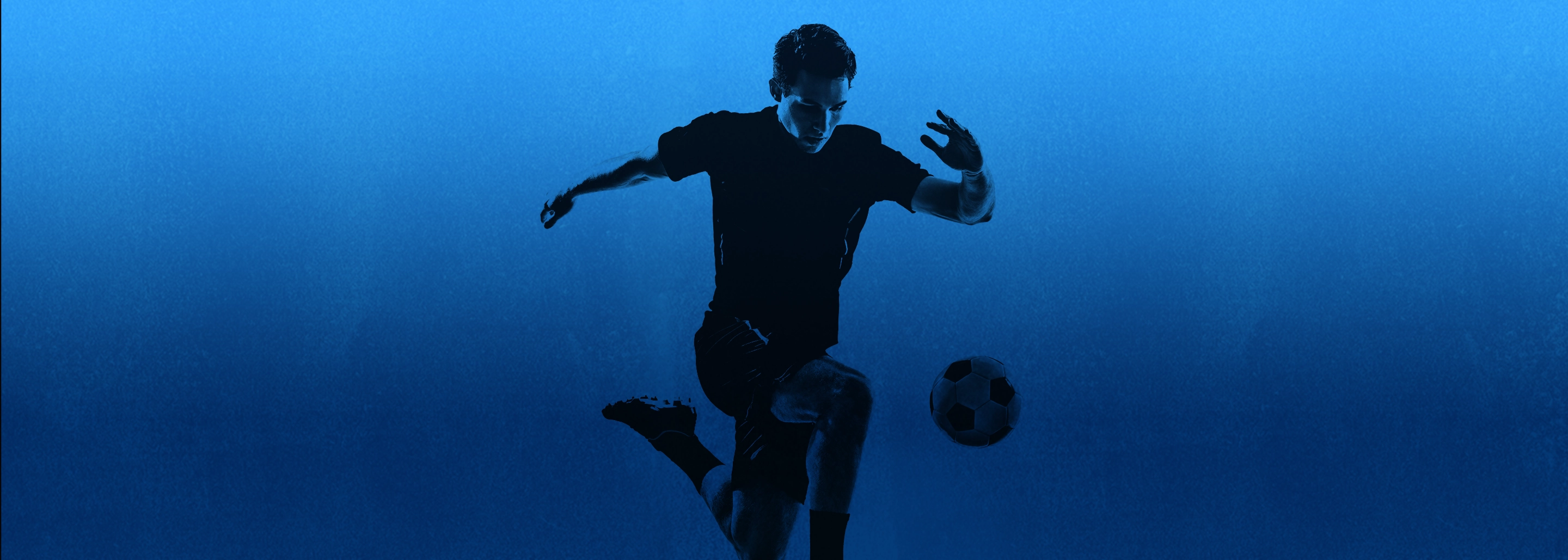 Man playing soccer with blue theme background.