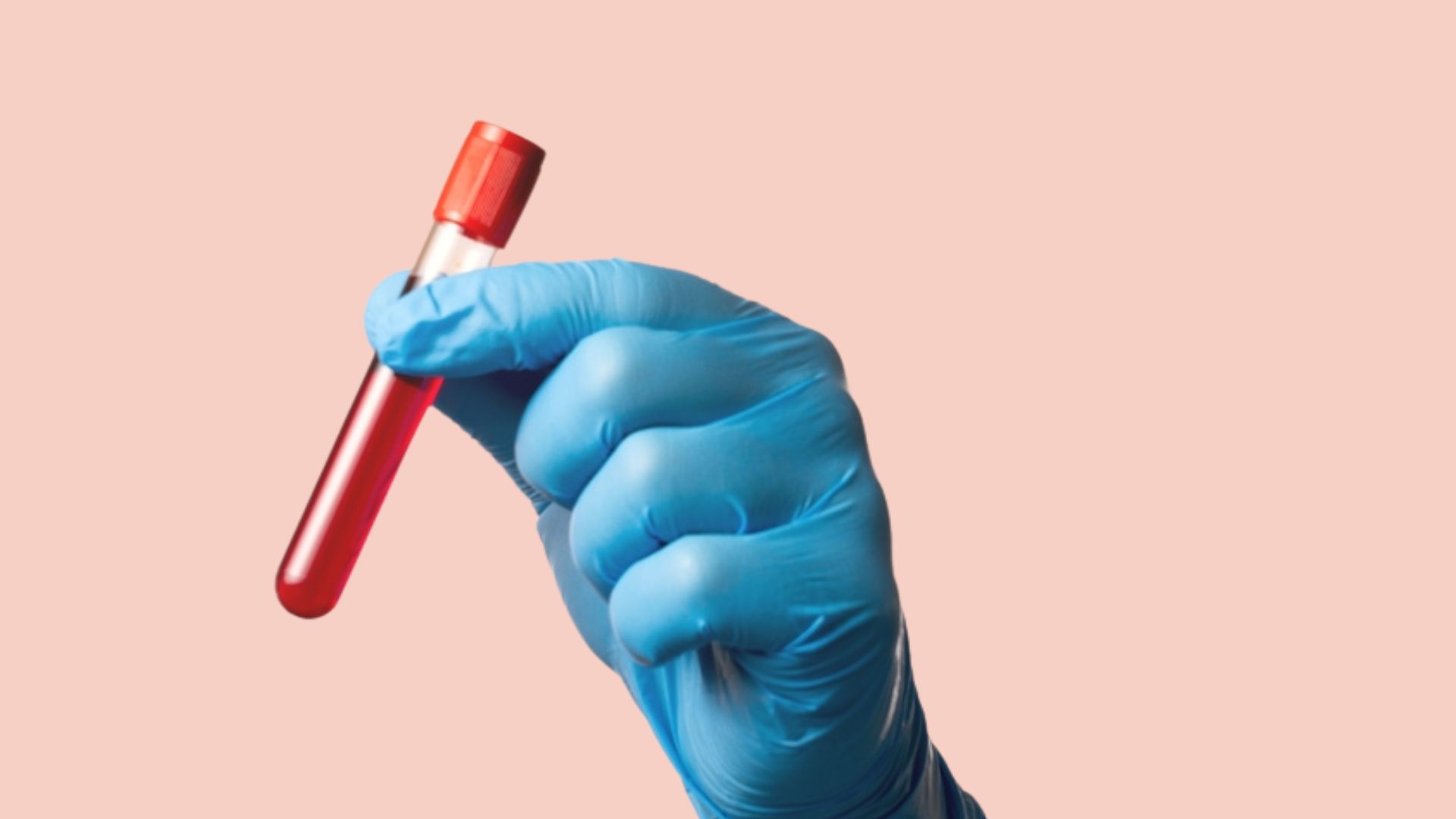 Blue gloved hand holding vial of blood against pale pink background.