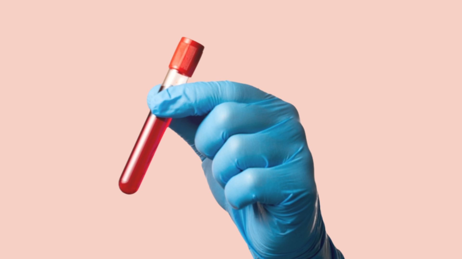 Blue gloved hand holding vial of blood against pale pink background.