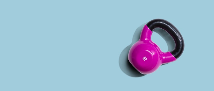 Purple kettlebell against blue background
