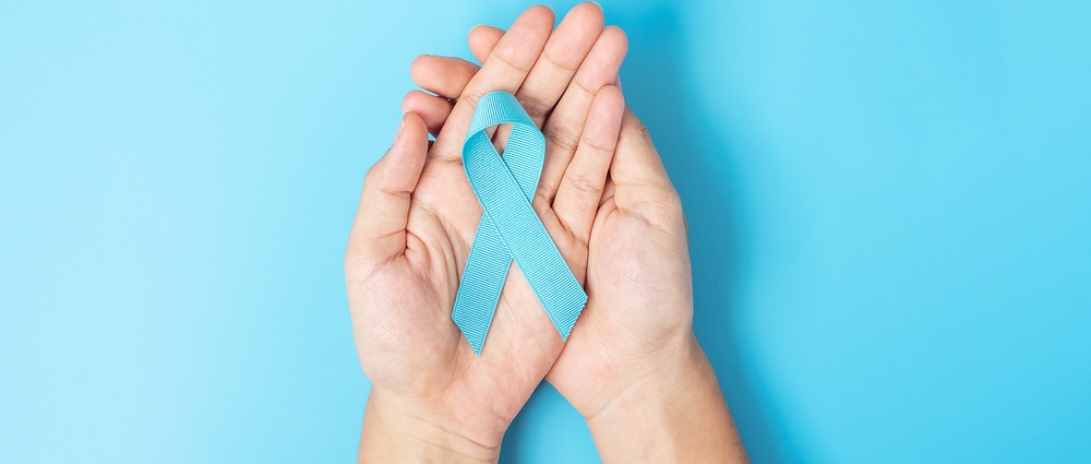 November Prostate Cancer Awareness month, Man holding light Blue Ribbon for supporting people living and illness. Healthcare, International men, Father, World cancer day and world diabetes day concept