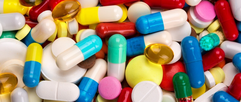 Close up view of assorted coloured vitamins.