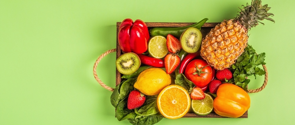 Fruits and vegetables rich in vitamin C in box. Healthy eating. Top view