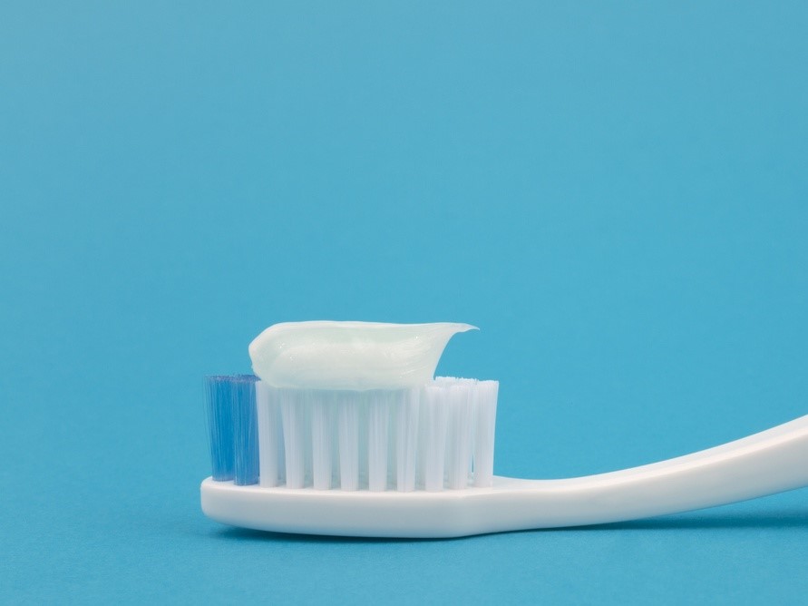toothpaste on brush