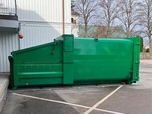 En grön mobil komprimator