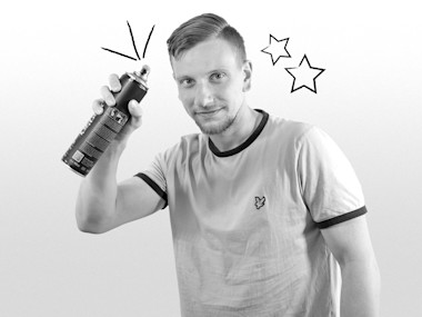 Mann mit Spraydose in der Hand