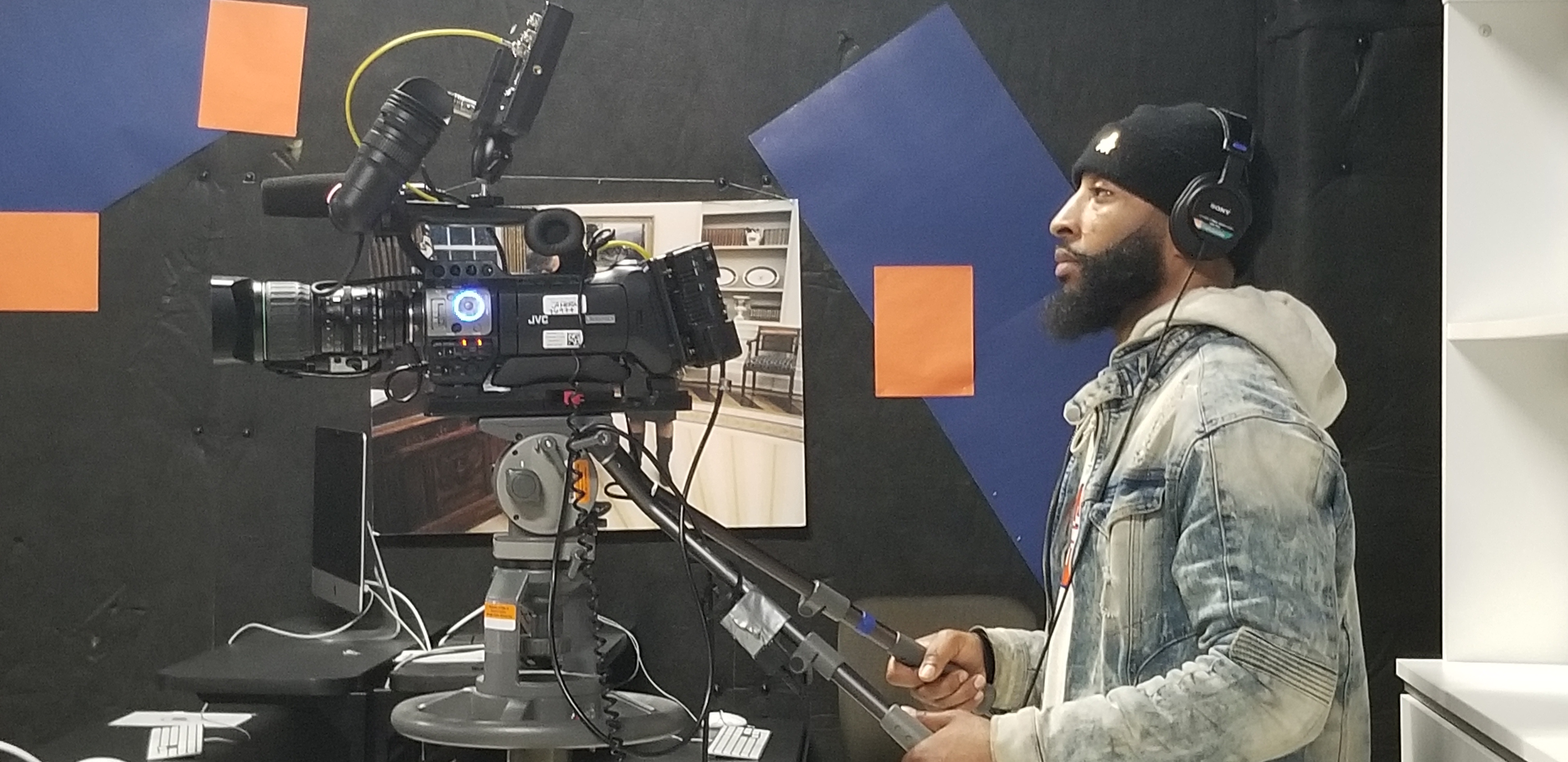 student working with a studio camera setup