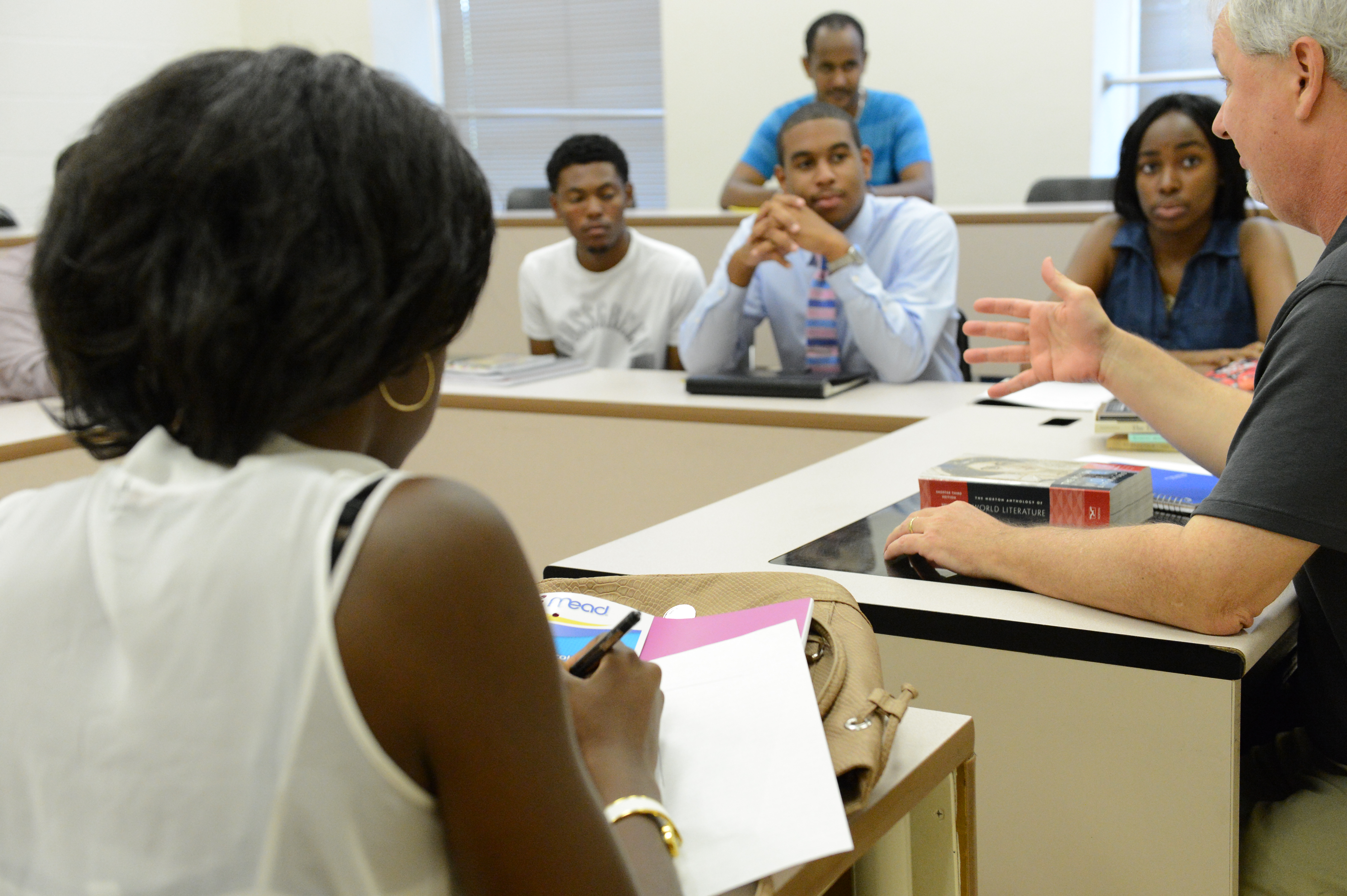 students and professor having a classroom discussion