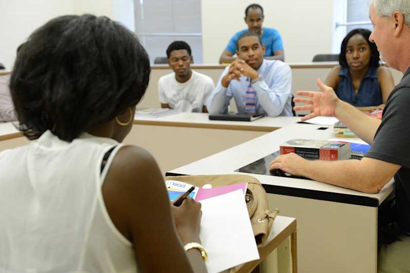 students and professor having a classroom discussion