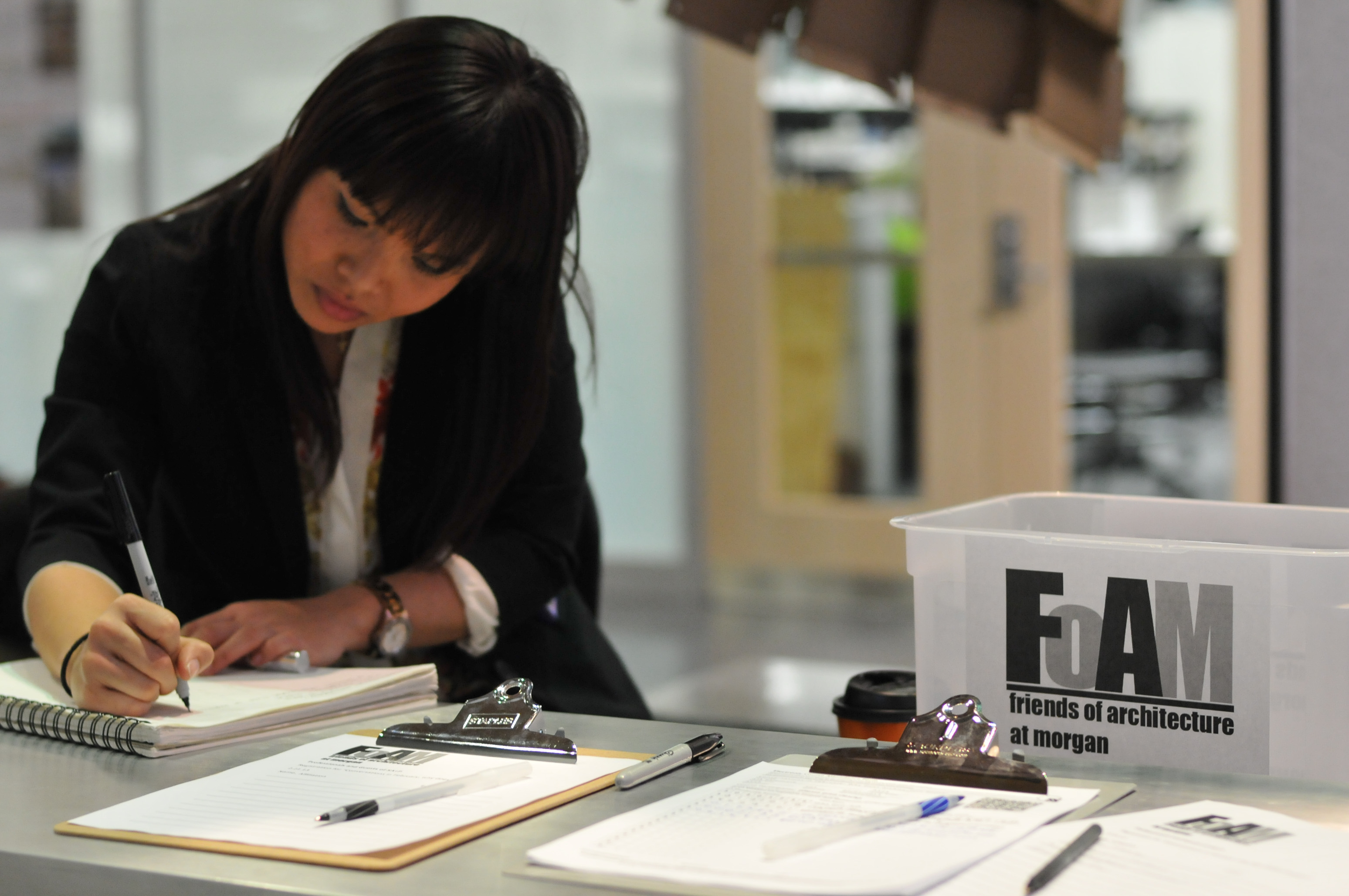 Student sketching in notebook