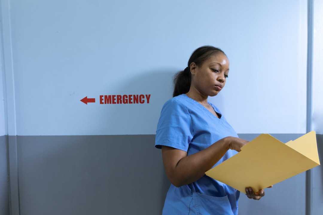 Nurse Reviewing Patient File