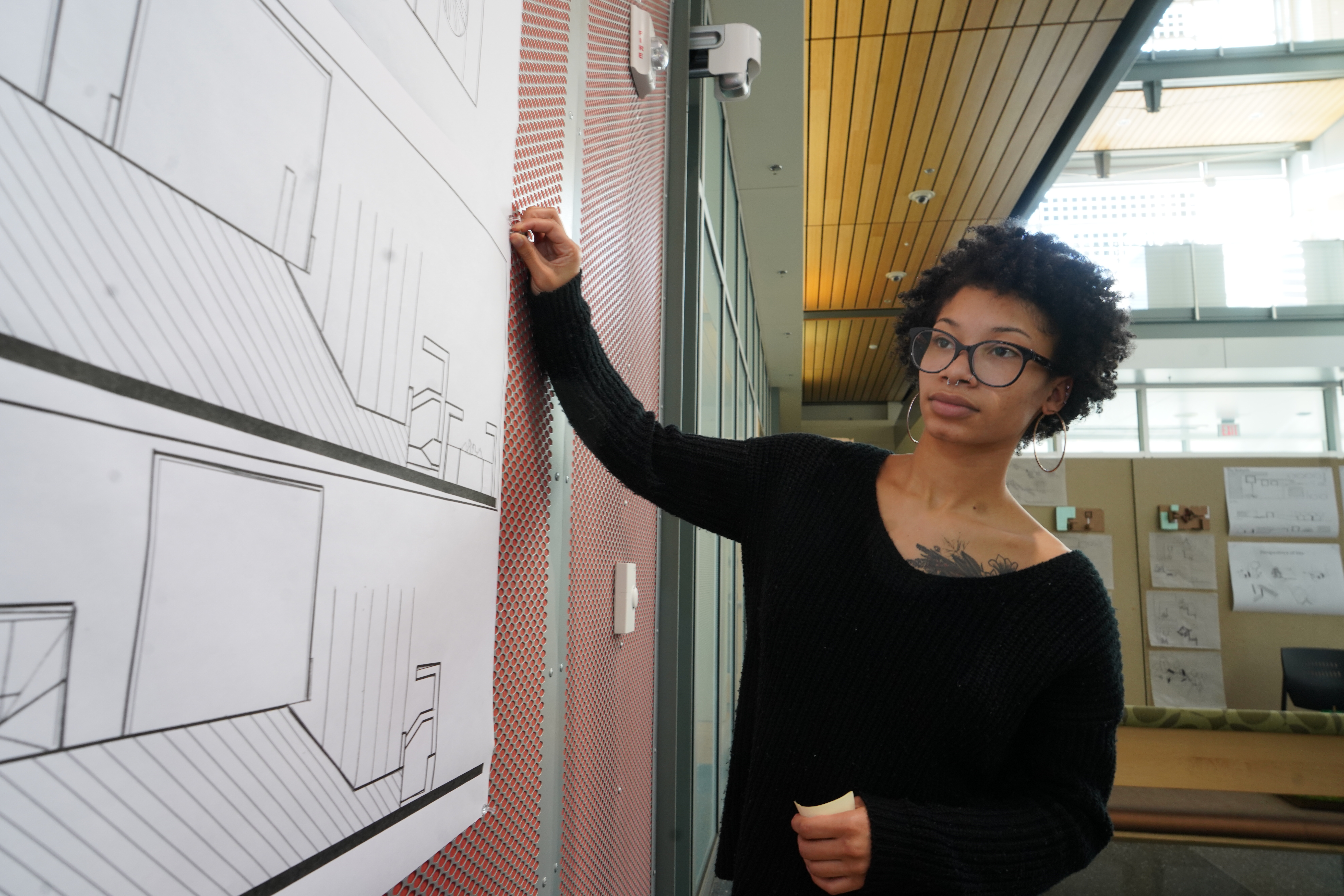 Student working on architectural drawings